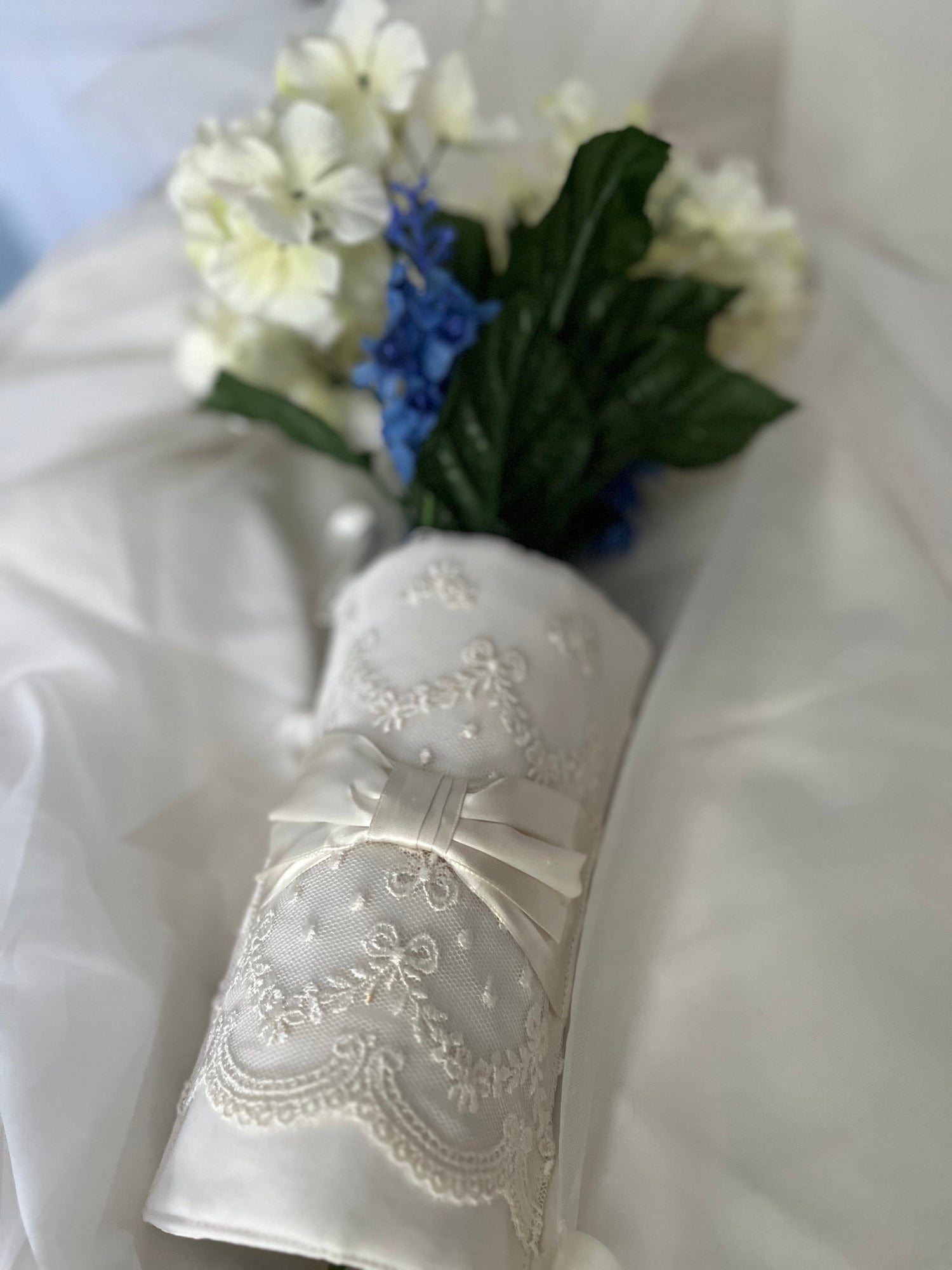 White heavily beaded wedding clutch with side handle.